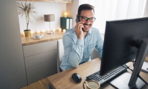 Man working at computer in bright office